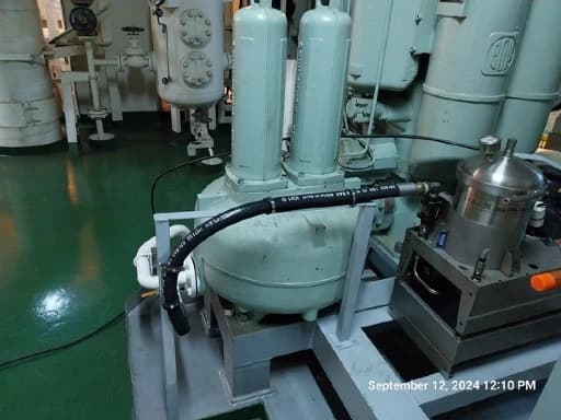 Delta-Xero offline filter connected by hoses beside marine engine-room equipment.