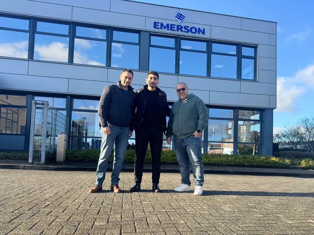 Three members of the project team outside Emerson's offices in Germany